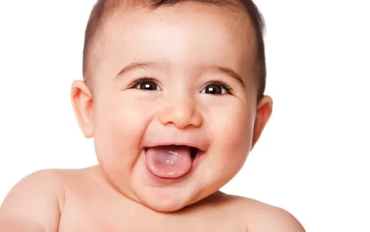a baby with a big smile