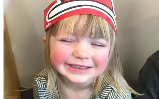 a girl with a red hat