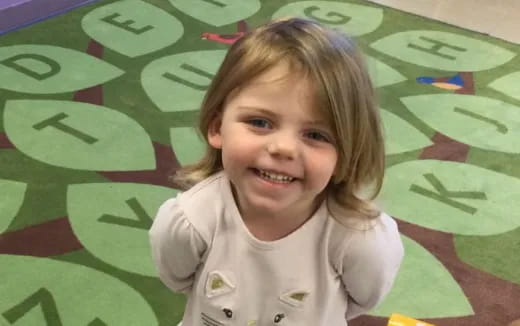 a child smiling for the camera