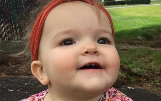 a baby with a red headband