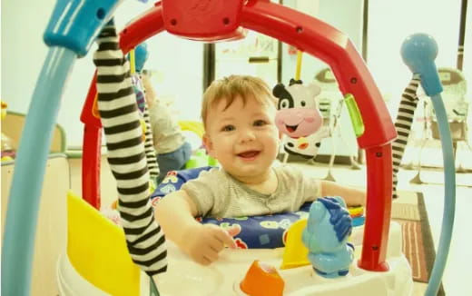a baby in a toy car