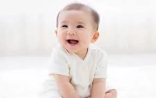 a baby with a surprised expression
