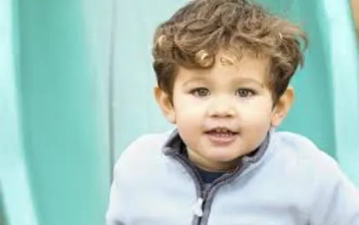 a boy smiling for the camera
