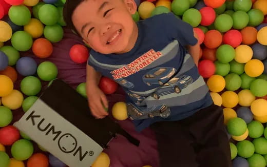 a boy lying in a pile of candy