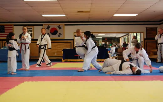 a group of people in karate uniforms