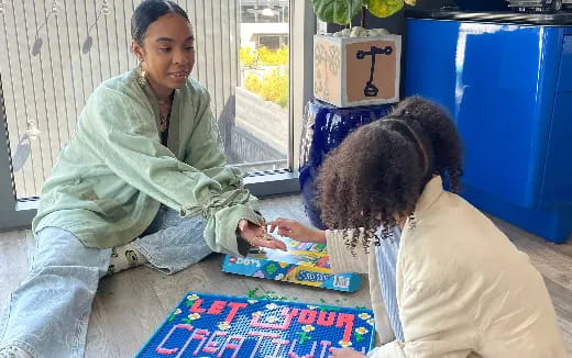 a person and a dog playing a game