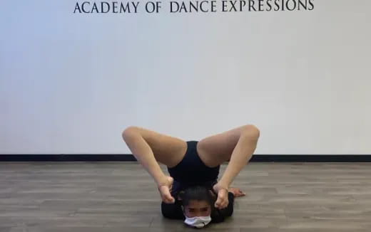 a woman doing a plank on a yoga mat