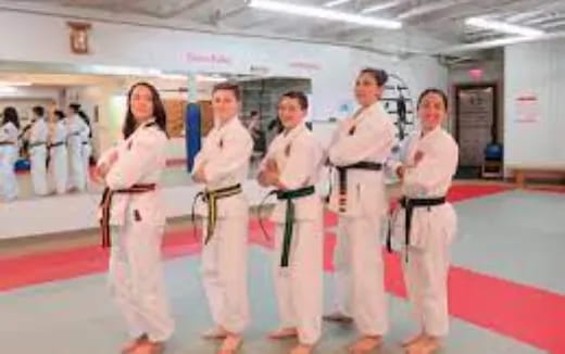 a group of people in karate uniforms