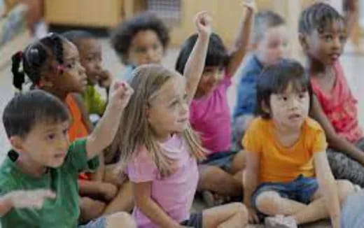 a group of children sitting on the floor
