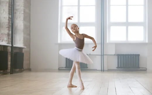 a woman dancing in a room