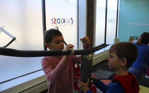 a few children playing with a toy