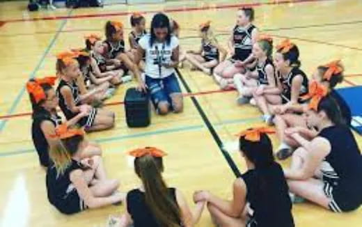 a group of people sitting on the floor