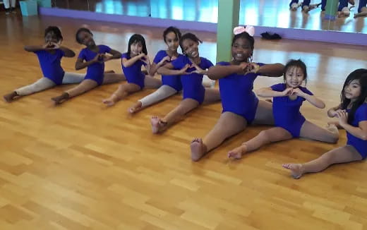 a group of girls in blue uniforms