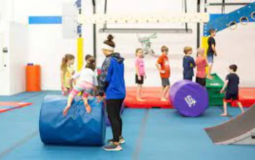 a group of children playing on mats