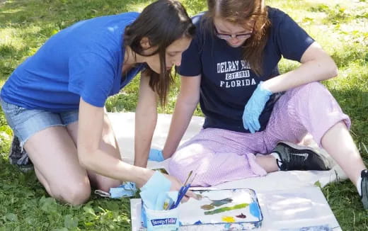 a few women doing a science experiment