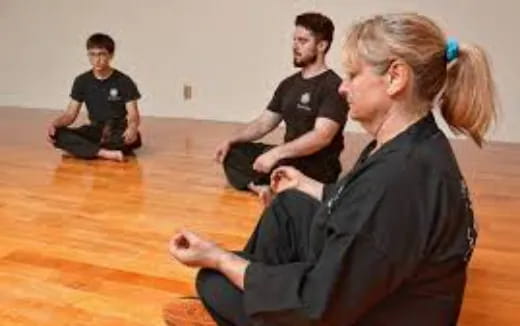 a group of people sitting on the floor