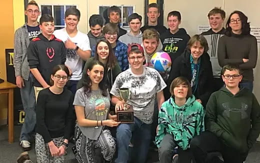 a group of people posing for a photo
