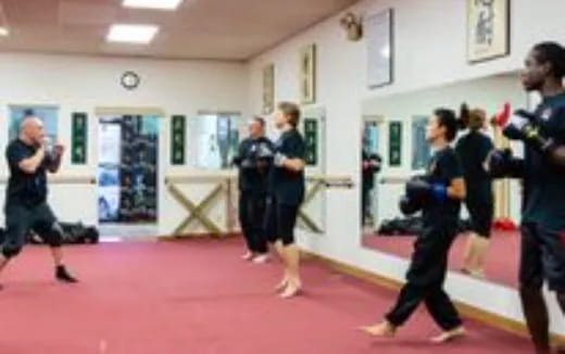 a group of people dancing in a room