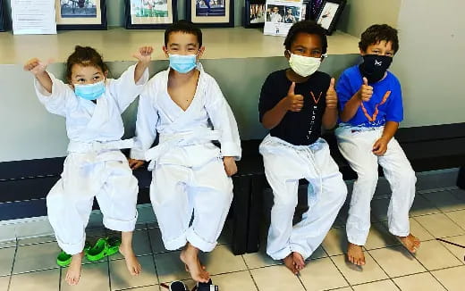 a group of boys wearing masks
