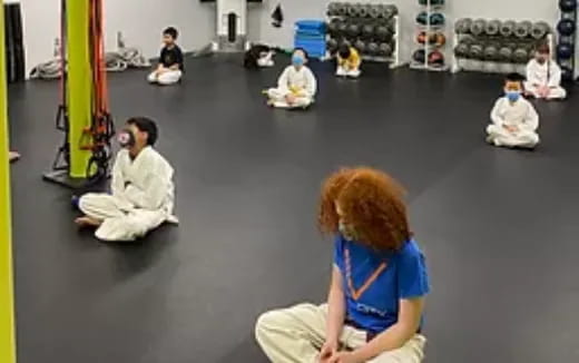a group of people sitting on the floor