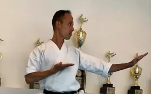a person with the arms out
