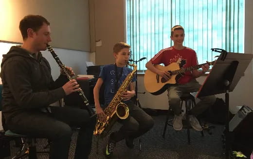 a group of men playing guitars