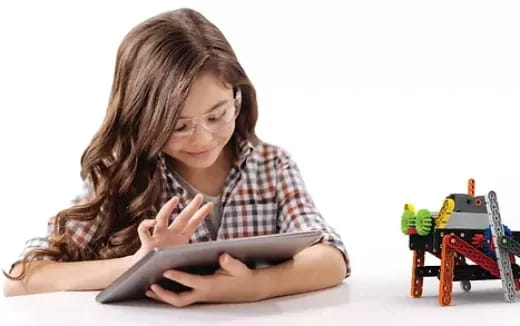 a woman looking at a tablet