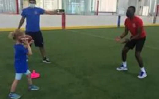 a group of people playing football