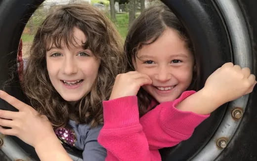 a couple of girls posing for the camera