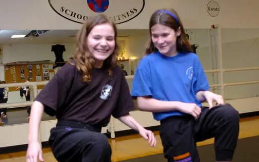 a couple of women posing for the camera