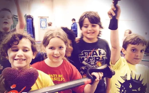 a group of kids posing for a photo