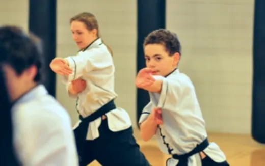 a group of boys in karate uniforms