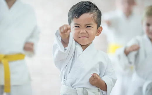 a young boy in a white shirt