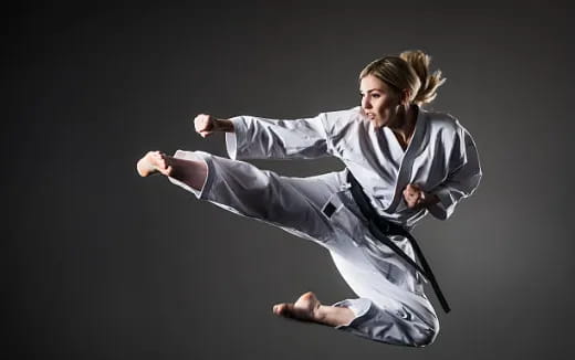 a man in a karate uniform
