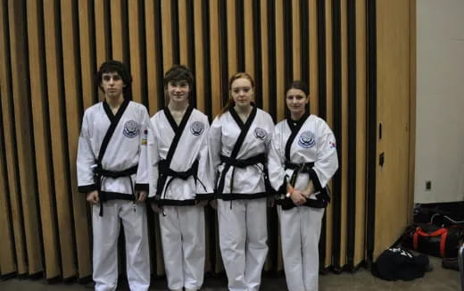 a group of men in karate uniforms