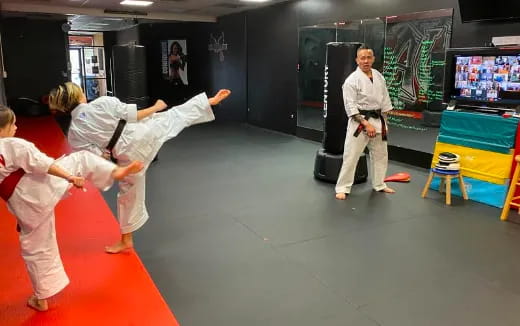 a group of people practicing martial arts