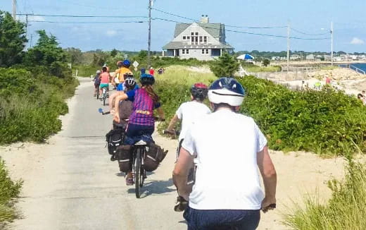 a group of people riding bikes
