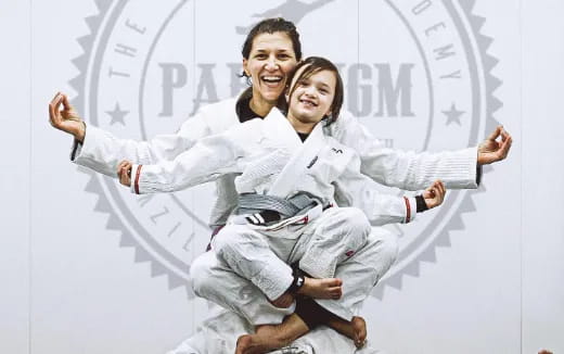 a man and woman in white karate uniforms