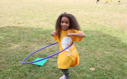 a little girl holding a kite