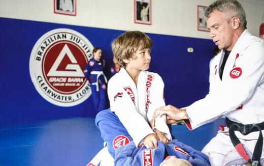 a man and a woman in karate uniforms