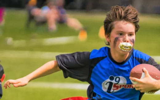 a person with a football in the mouth