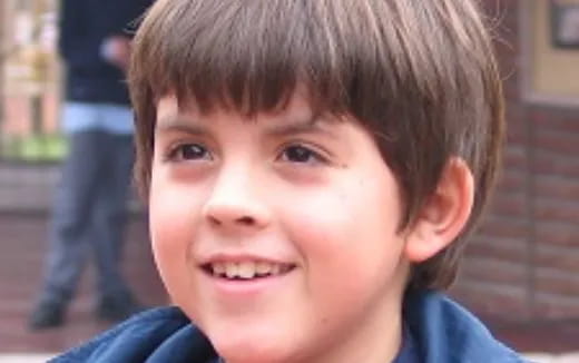 a close-up of a boy smiling