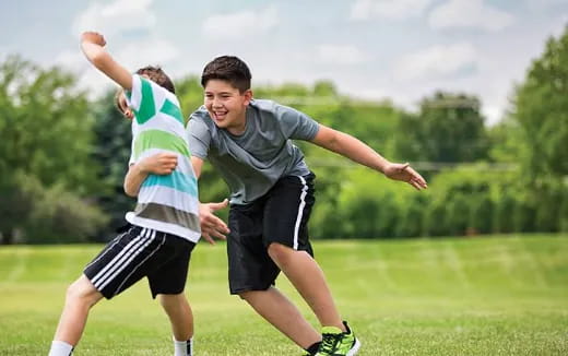 a couple of men playing football