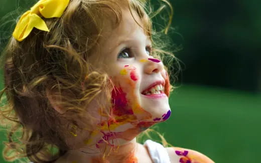 a girl with a flower on her face