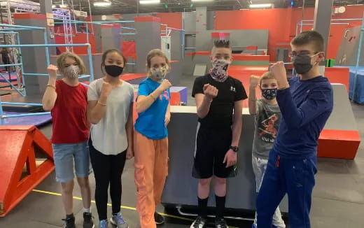 a group of people wearing masks