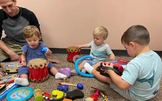 a group of children playing with toys