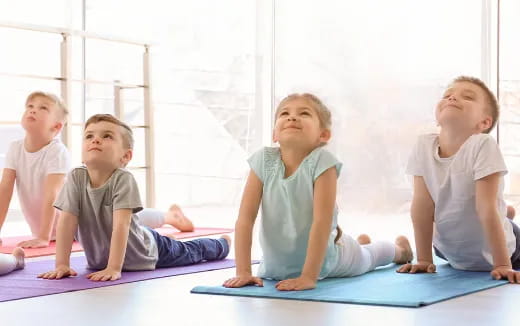 a group of children sitting on the floor