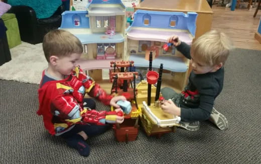 a couple of kids playing with toys