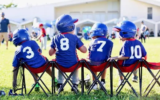 a group of kids wearing helmets