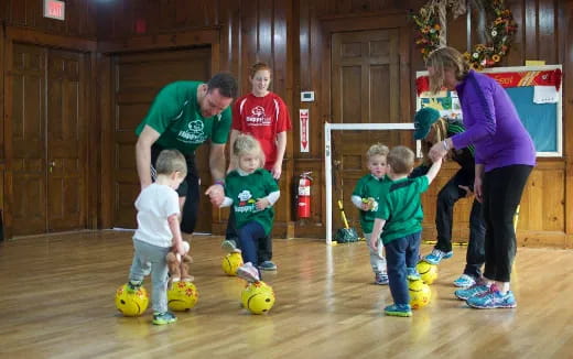 a group of people playing with balls